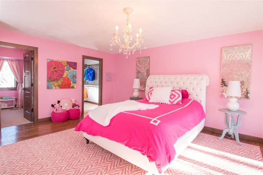 Cool bedroom with beaded chandelier and pink painted walls