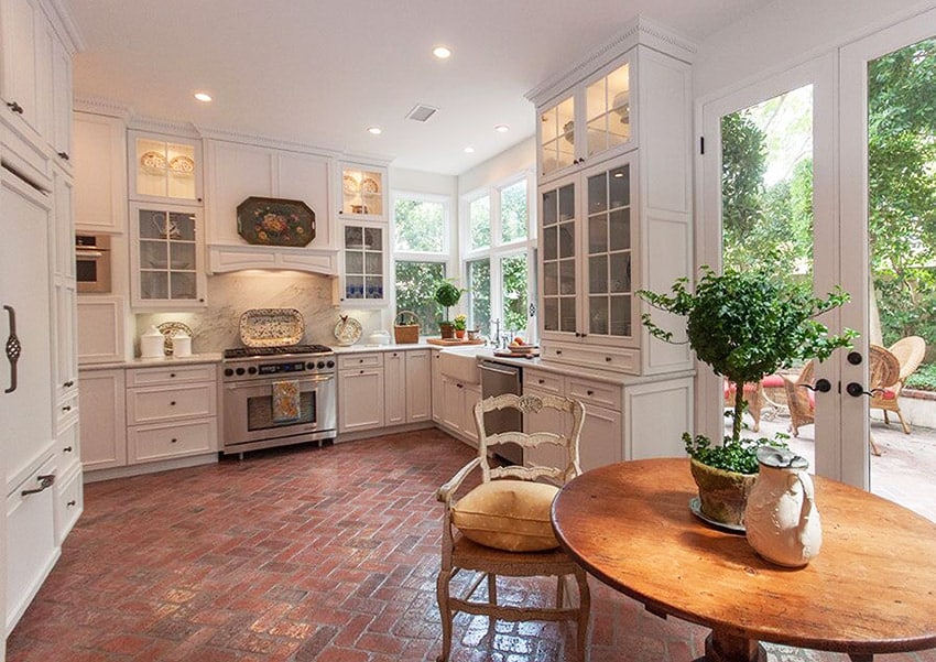 Cottage kitchen with brick flooring