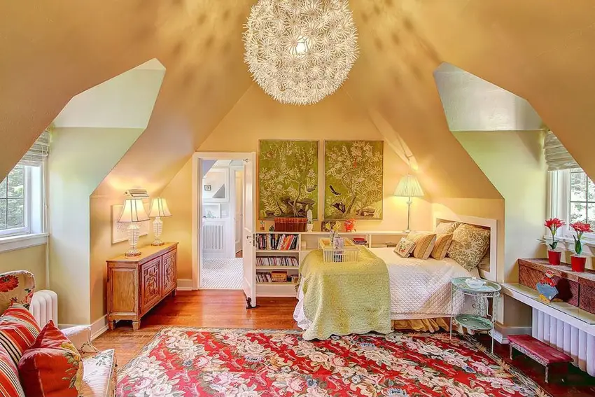 Attic bedroom with large round light fixture