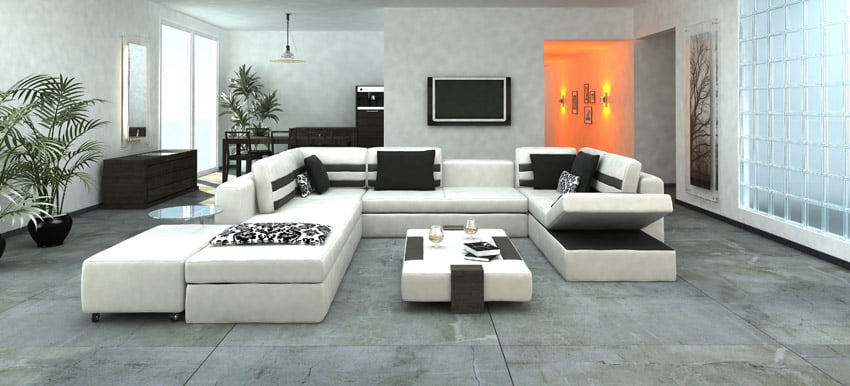 Gray floor tiles, wall tiles made of glass and white couches