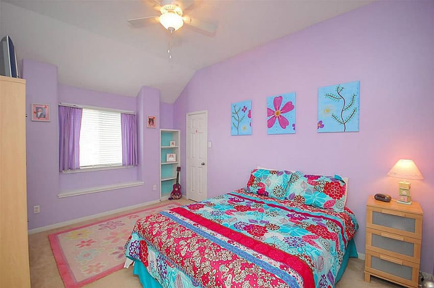 Fun and bright girls bedroom with purple walls