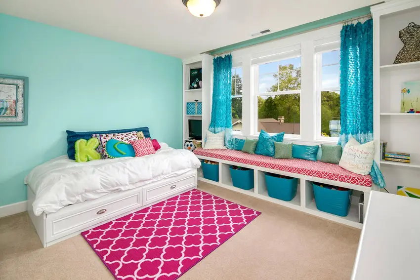 Bedroom with basket storage area and teal wall