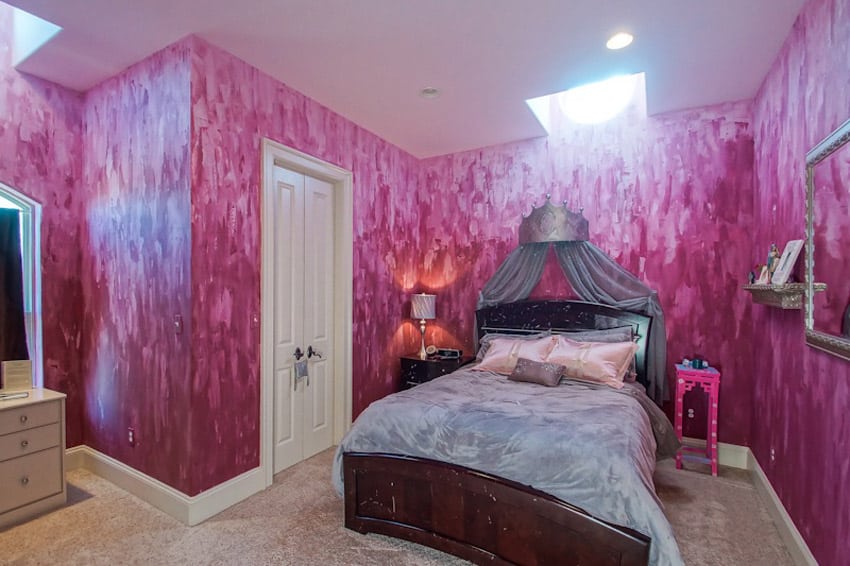 Girls bedroom with violet paint brushed walls