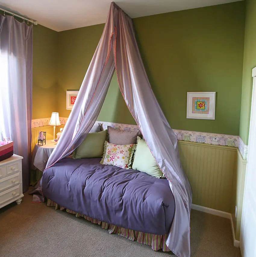 Bedroom with purple bed drapery