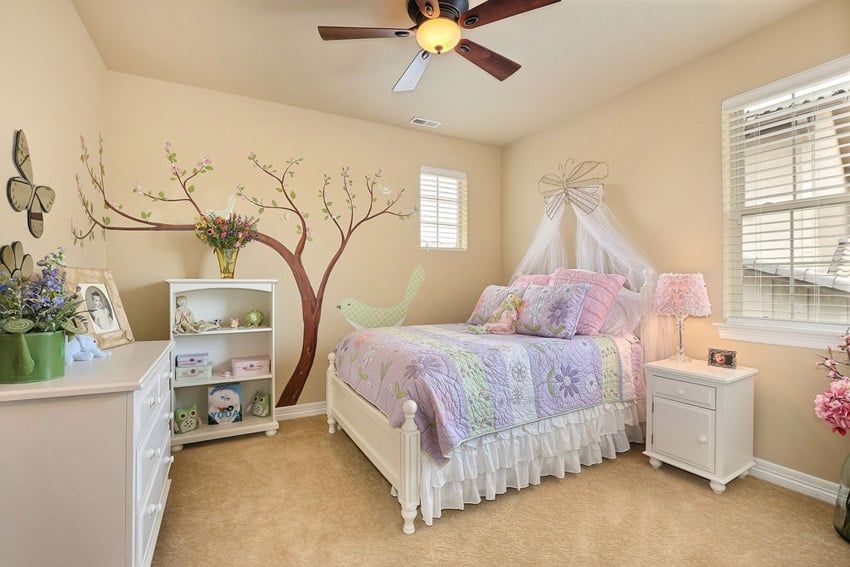 Bedroom with wall mural and white furniture