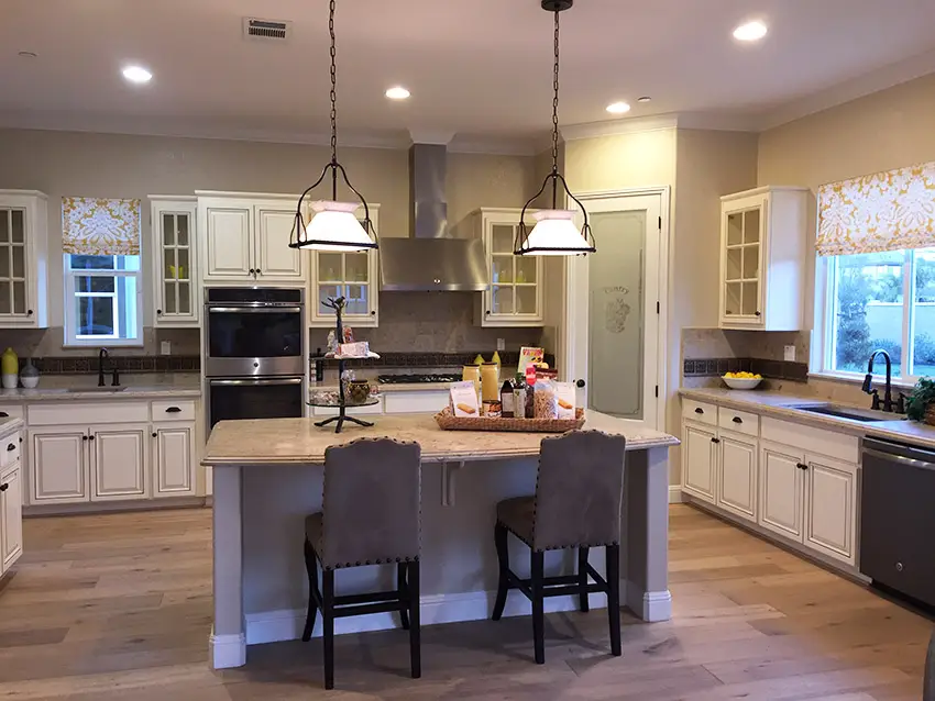Home kitchen with chairs and island