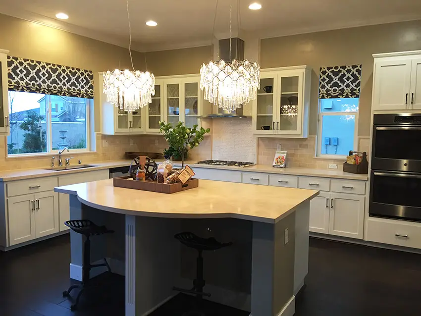 Kitchen with breakfast bar island and white cabinets