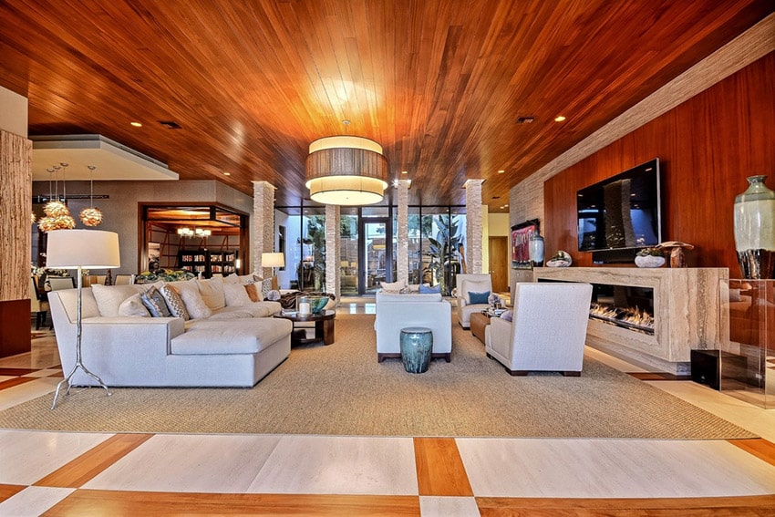 Large modern living room with white furniture and wood flooring