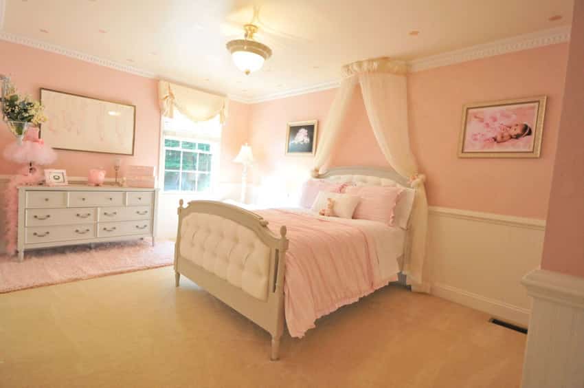 Little girls bedroom with bed canopy curtain
