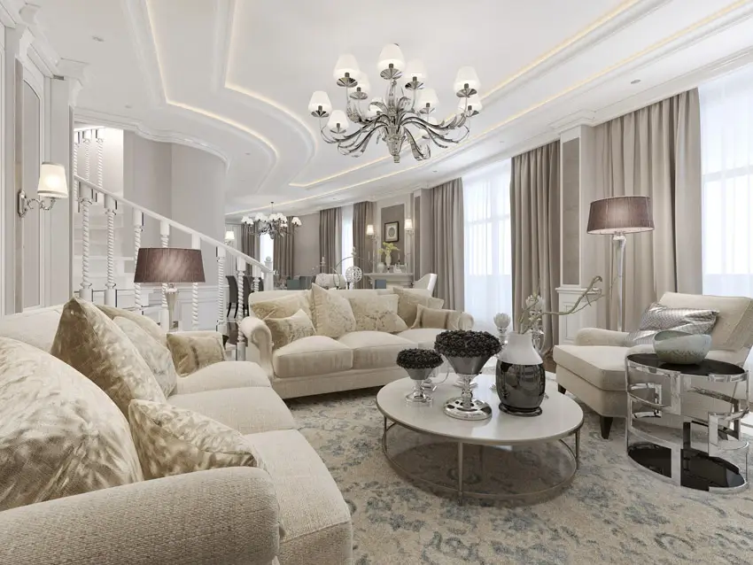 Room with elegant scroll arm sofas and circular coffee table