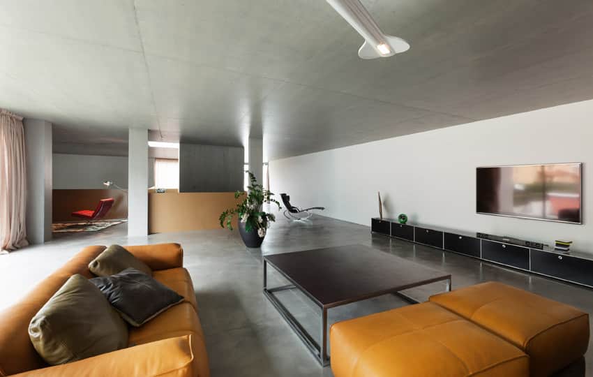 Modern living design with orange leather furniture