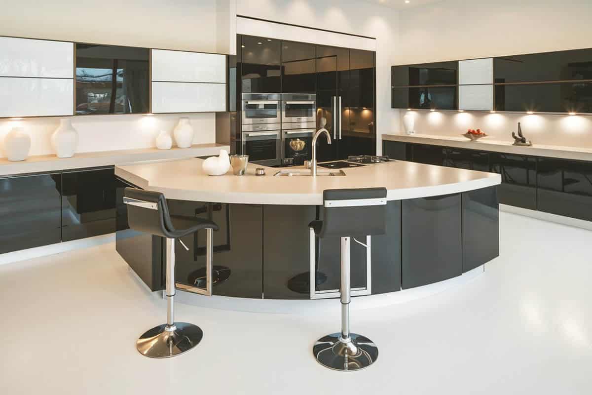 Open plan modern kitchen with large wraparound island