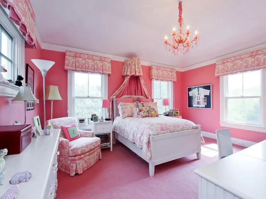 Pink bedroom with decorative chandelier