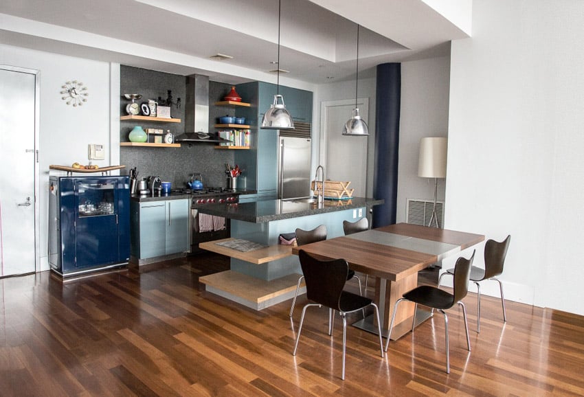 Kitchen with metallic blue cabinets and wood panel floors