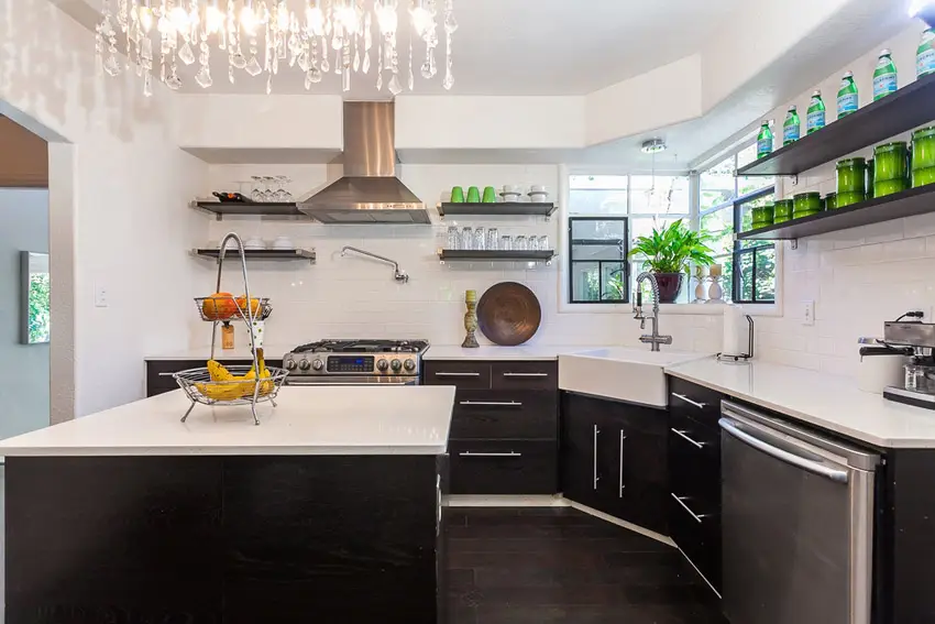 Kitchen with floating shelves, ebonny island and sink
