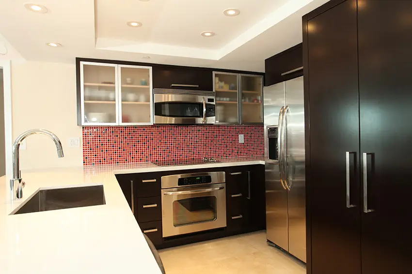 Small modern kitchen with mosaic tile backsplash