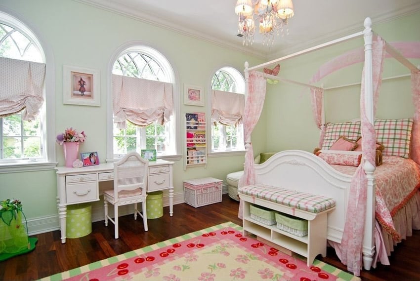 Pretty furnished girls room with four post bed