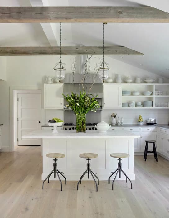 Kitchen with ceiling beam island and open shelving