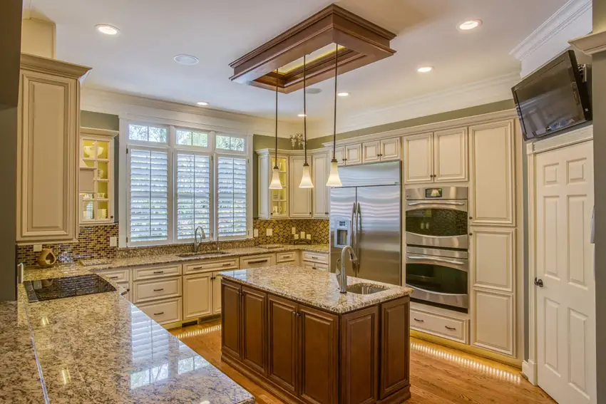 Kitchen with light oak floors and sink on the center island