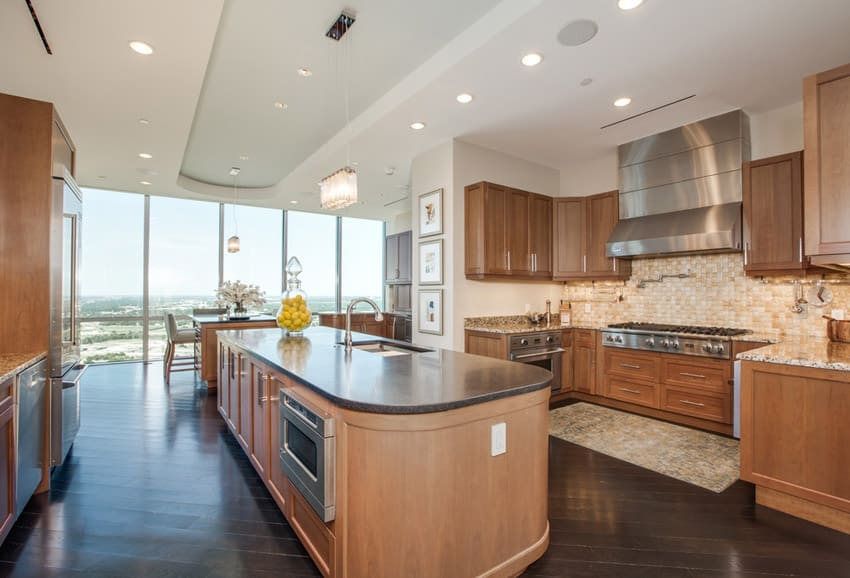 Kitchen with panoramic windows, hardwood floors and maple wood island