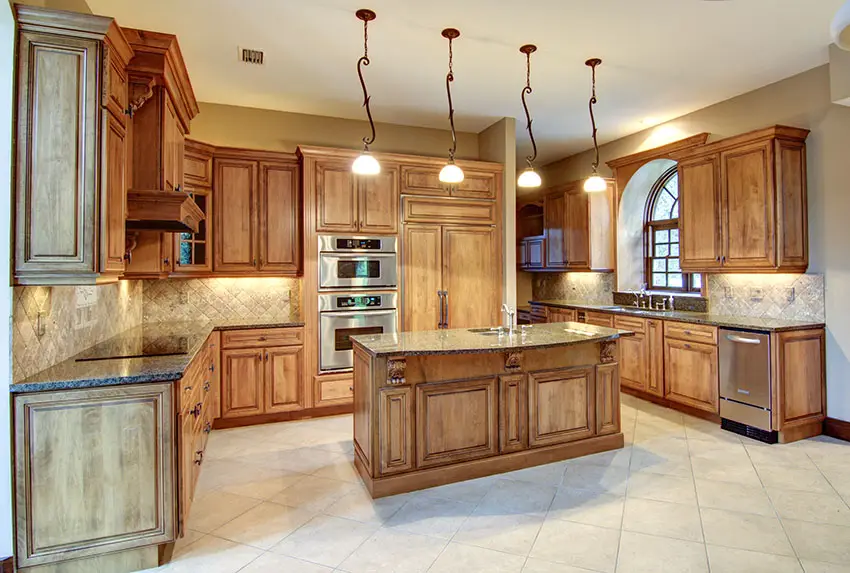Contemporary kitchen with wood island, tile flooring, and decorative pendant lights