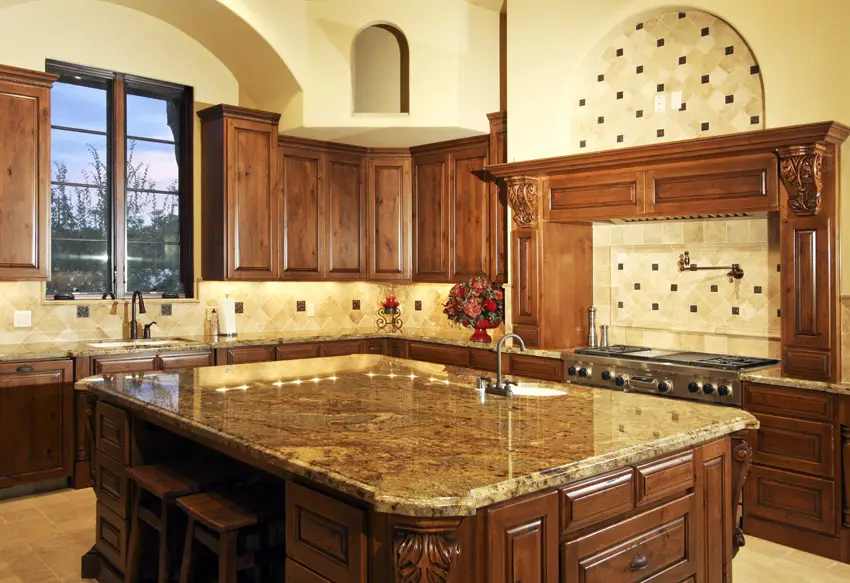 Italian style kitchen with beige granite slab counters
