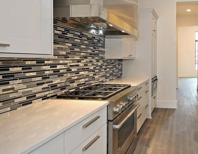 Kitchen remodel project with quartz counter and glass backsplash