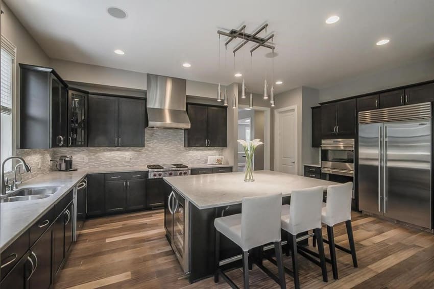 Kitchen with luxury finishes, mosaic tile backsplash and large dining island