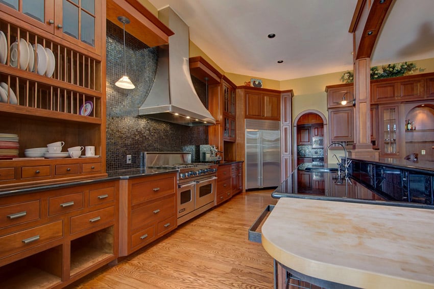 Kitchen with oak flooring and steel hood