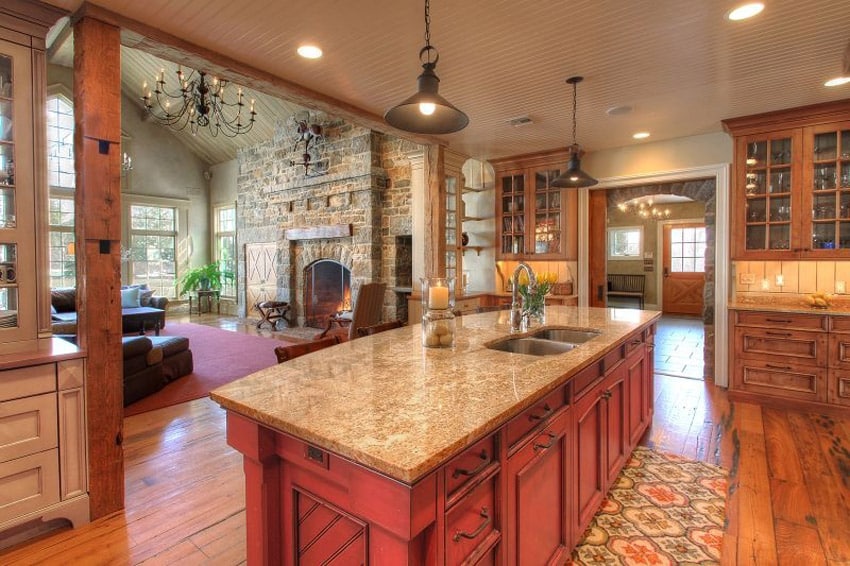 Kitchen with brick walls, geometric rug and undermount sink