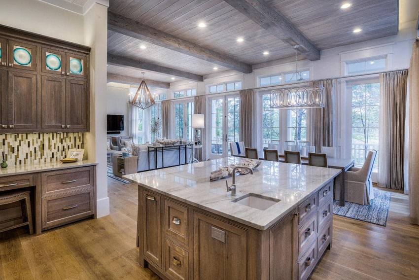 Kitchen with wood shaker cabinets and beamed ceiling