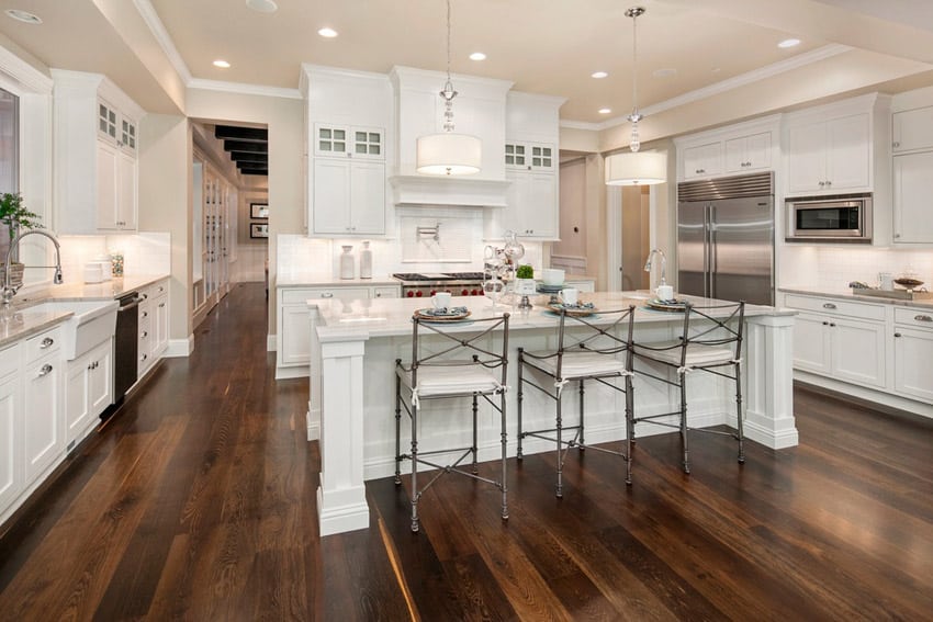 cabinets with round knobs, chrome faucets, flush lights and light cream ceiling