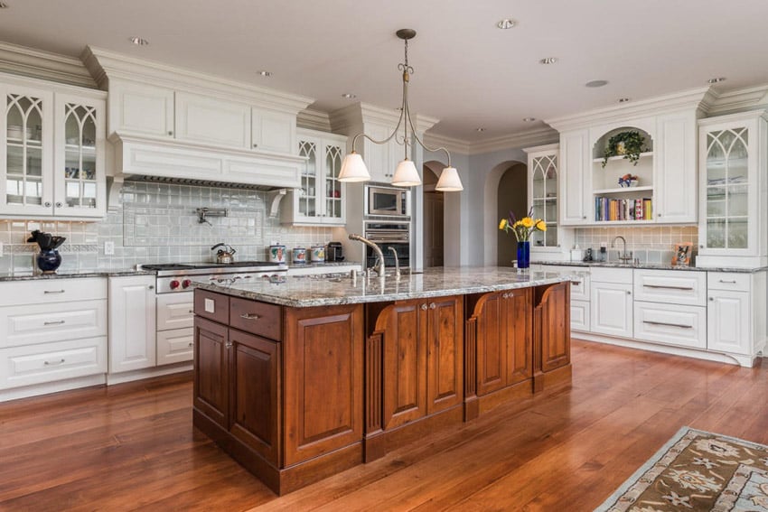 Traditional kitchen with alpine white granite counters and wood island