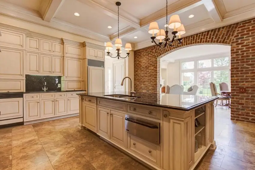 Kitchen with coffered ceiling and white flat panel cabinets