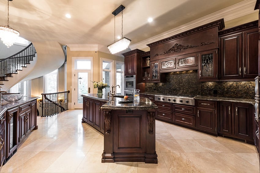 Kitchen with view of the grand staircase, solid mahogany cabinets and cream floors