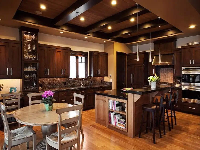 Transitional kitchen with dark wood cabinets, mosaic tile back splash, and solid surface counter dining area