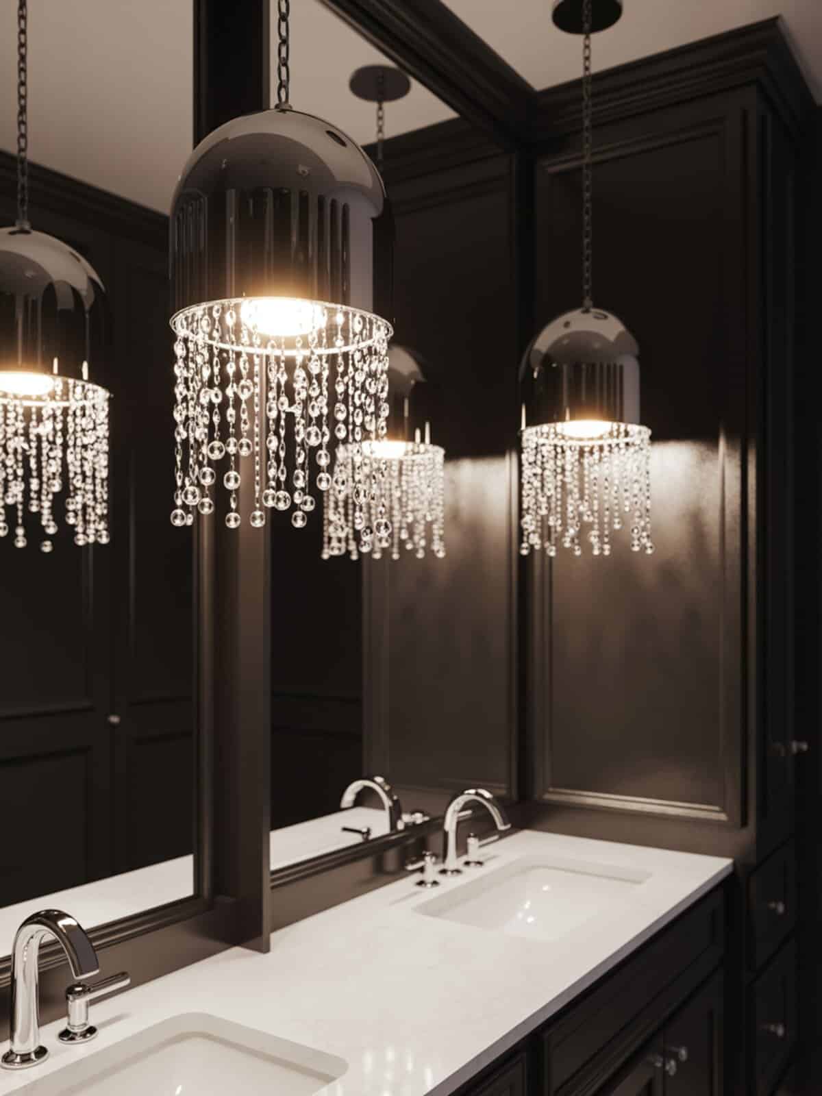 Black dome pendants with cascading crystal beads over a white marble double vanity