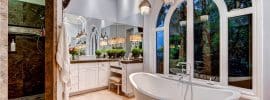 beautiful-master-bath-with-tub-and-pendant-lights-with-hanging-glass