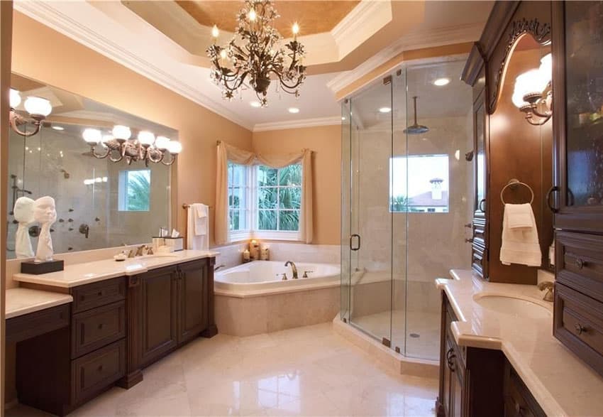 Beautiful primary bath with traditional chandelier