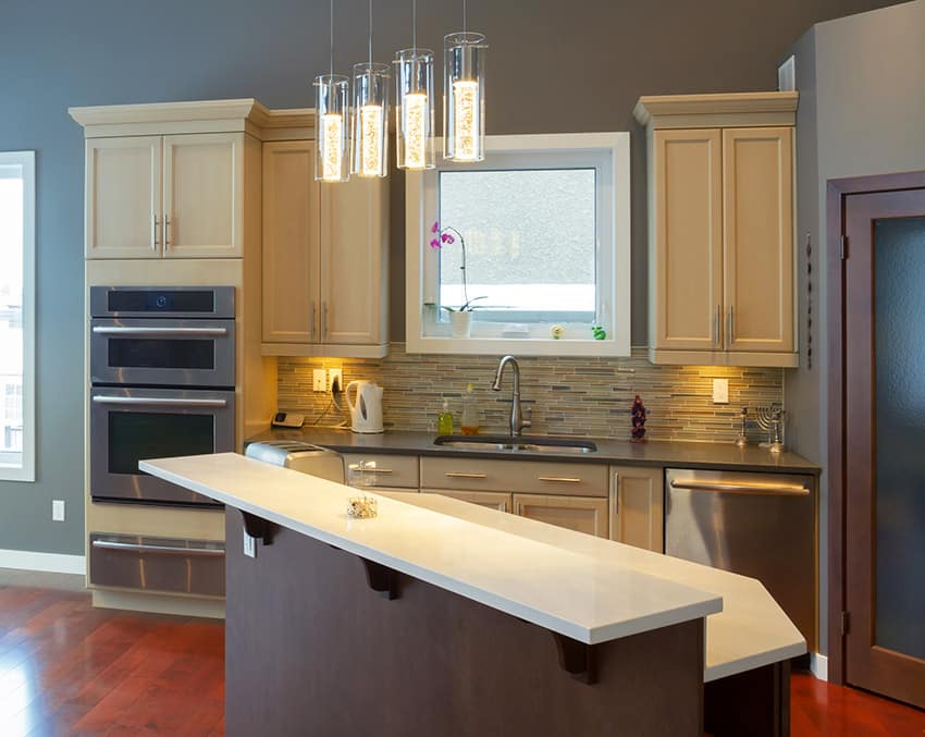 Compact contemporary kitchen with light yellow cabinetry