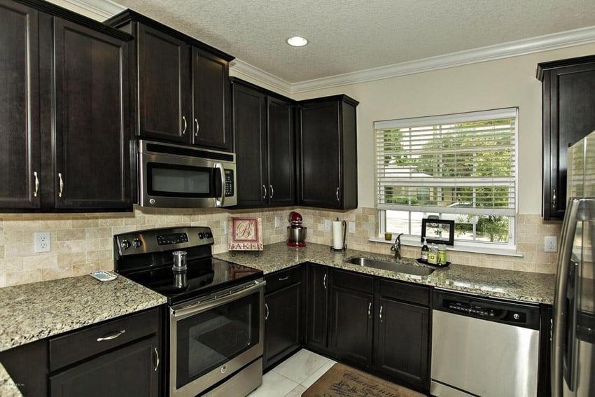 Compact corner kitchen with barcelona granite countertops