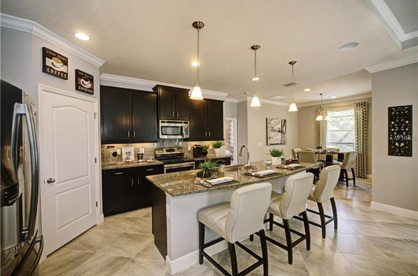 Compact kitchen with tropic brown granite countertops