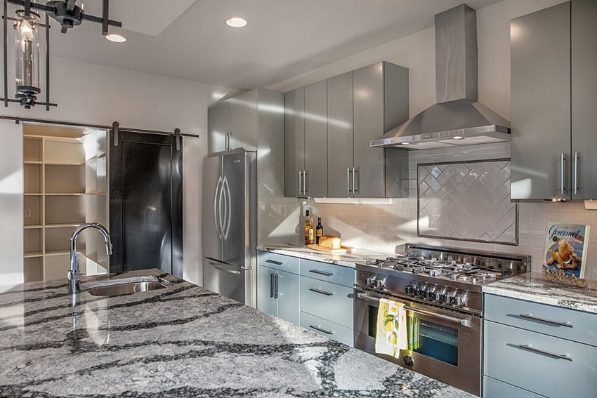 Compact luxury kitchen with complex granite counters two types of cabinets