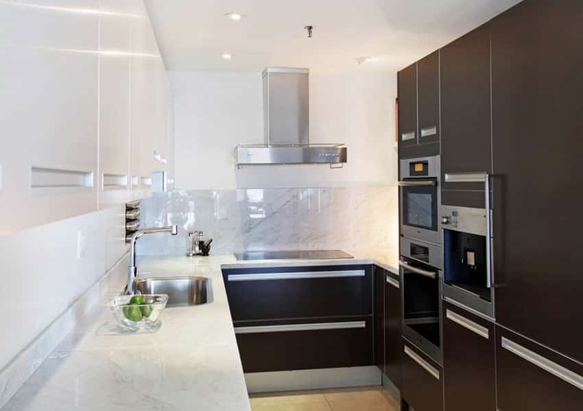 Compact modern kitchen with carrara marble counters