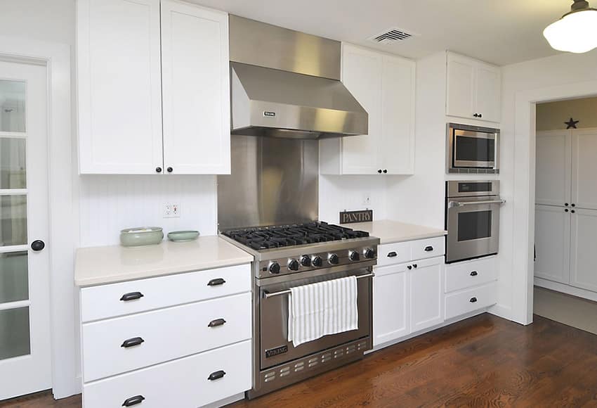 Compact modern kitchen with white quartz counter