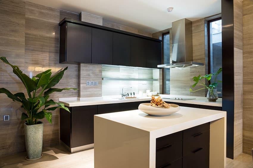 Compact modern kitchen with white counters and brown cabinets