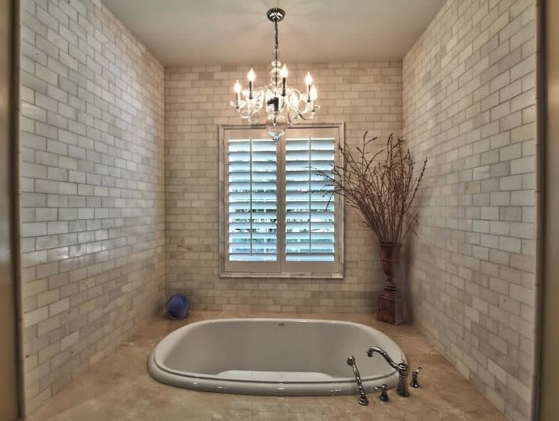 Contemporary bath area with hanging chandelier