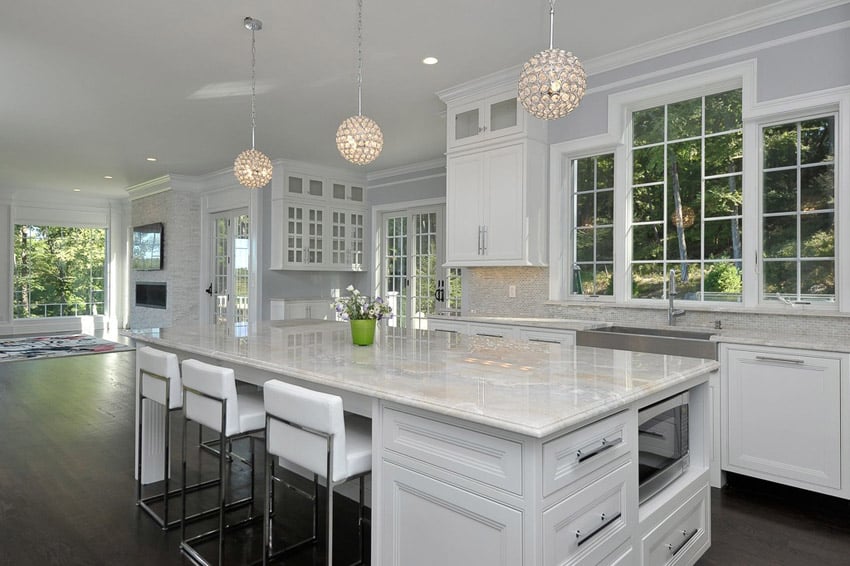 Kitchen with French cabinet doors with lilac gray walls and Carrara countertops