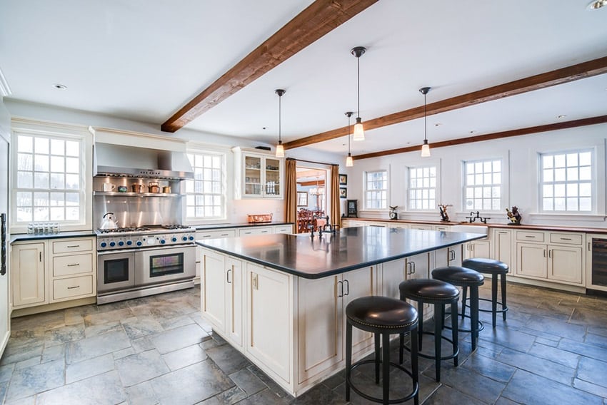 country kitchen with white cabinets dark counters