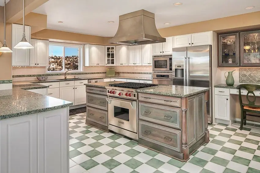 Kitchen with green and white checkerboard floors, and island with antique green finish